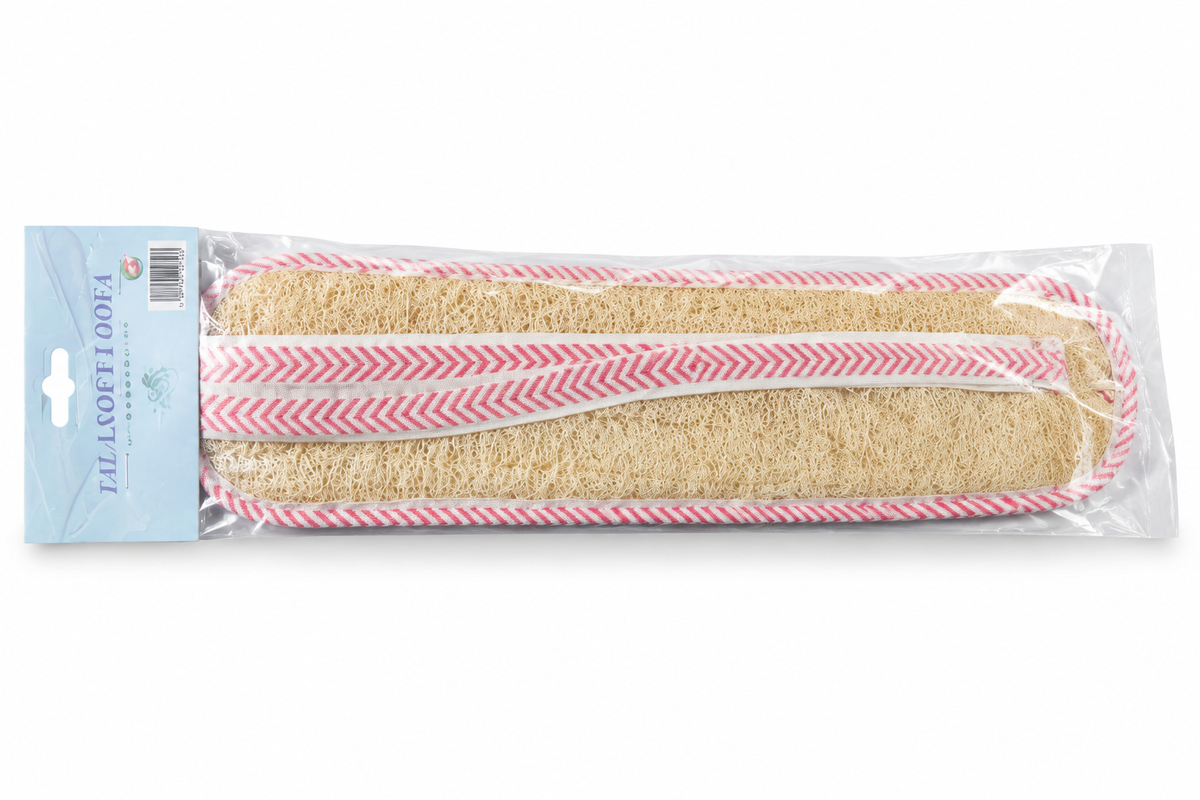 Long beige loofah bath scrubber with pink-and-white trim in clear retail packaging on white background